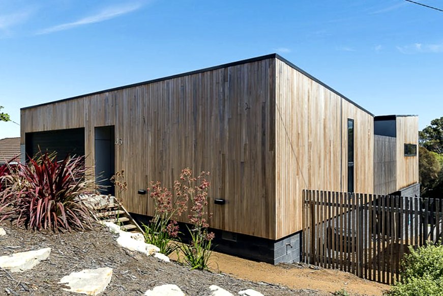Fort Direction exterior, silvertop ash cladding over blockwork base, 1+2 Architecture