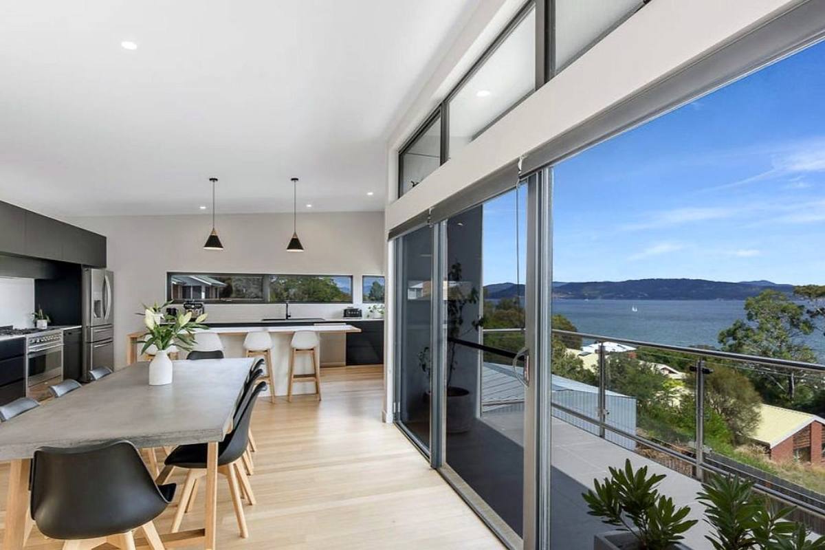 Fort Direction new residence, kitchen and dining with water views, 1+2 Architecture, built by LHPL Contracting