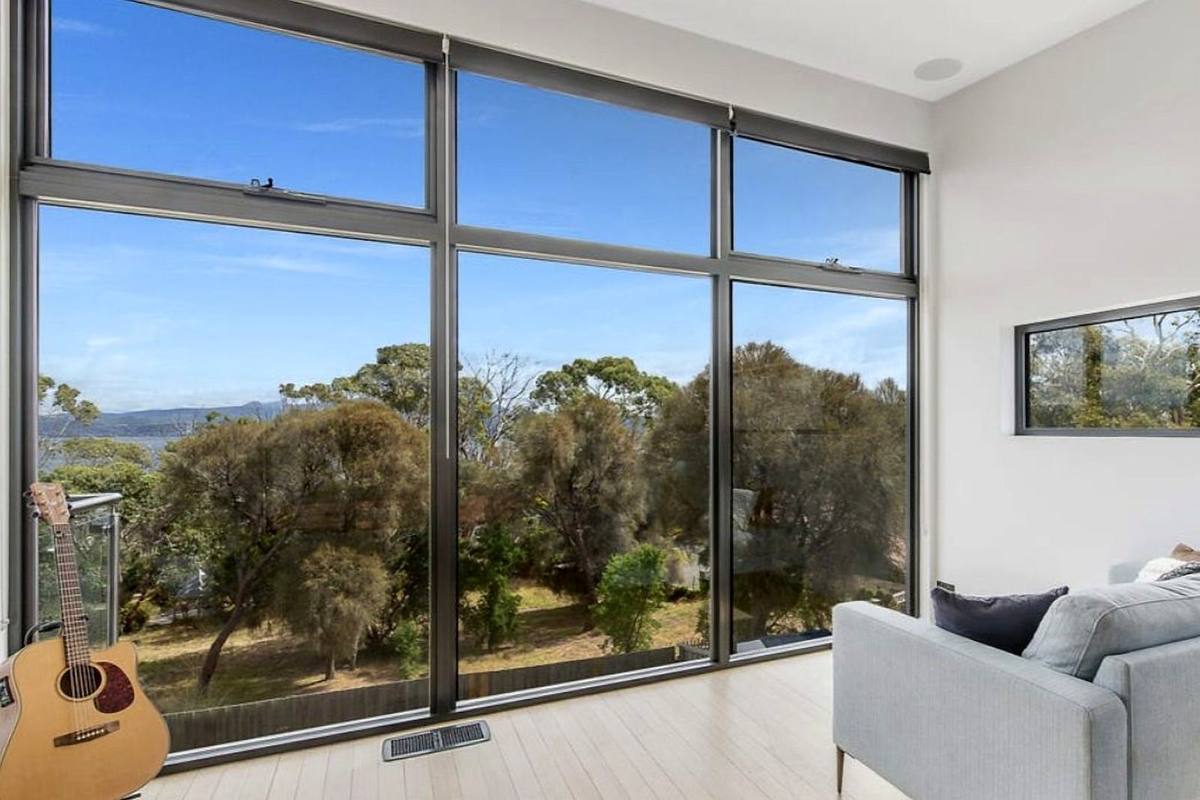 Fort Direction new residence, living room with full-height glazing, built by LHPL Contracting