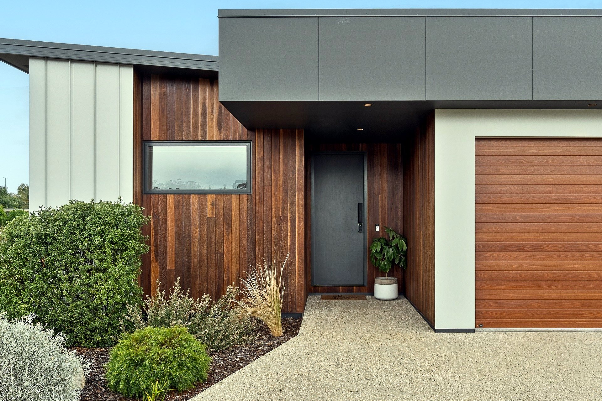 Pardalote new residence, Hobart, timber-clad entry, designed by Dynamic Design, built by LHPL Contracting